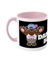 Load image into Gallery viewer, A Brown Bear wearing a white crop top, blue short shorts and a blue and pink baseball cap on back to front.
