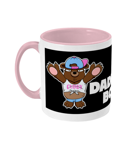 A Brown Bear wearing a white crop top, blue short shorts and a blue and pink baseball cap on back to front.
