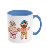 Load image into Gallery viewer, Gay bearded couple in their swimming speedos, one of who is badly sunburnt on a mug
