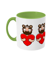 Load image into Gallery viewer, Fun design showcasing a furry bearded gay wearing bear ears embracing a vibrant red heart and giving it a hug.
