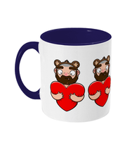 Load image into Gallery viewer, Fun design showcasing a furry bearded gay wearing bear ears embracing a vibrant red heart and giving it a hug.
