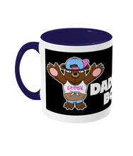 Load image into Gallery viewer, A Brown Bear wearing a white crop top, blue short shorts and a blue and pink baseball cap on back to front.
