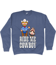 Load image into Gallery viewer, A gay cowboy wearing checked shirt, jeans, chaps and a cowboy hat standing next to a naked man hog tied with red rope.
