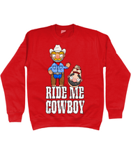 Load image into Gallery viewer, A gay cowboy wearing checked shirt, jeans, chaps and a cowboy hat standing next to a naked man hog tied with red rope.
