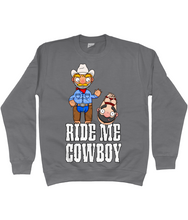 Load image into Gallery viewer, A gay cowboy wearing checked shirt, jeans, chaps and a cowboy hat standing next to a naked man hog tied with red rope.
