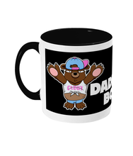 Load image into Gallery viewer, A Brown Bear wearing a white crop top, blue short shorts and a blue and pink baseball cap on back to front.
