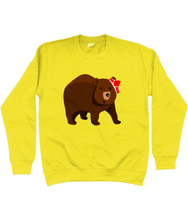 Load image into Gallery viewer, Big brown bear with red pants on his head on a yellow sweater
