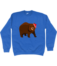 Load image into Gallery viewer, Big brown bear with red pants on his head on a blue sweater
