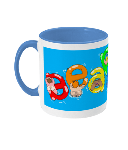 Gay bears paddling on inflatables spelling out Bear Soup on a blue and white mug