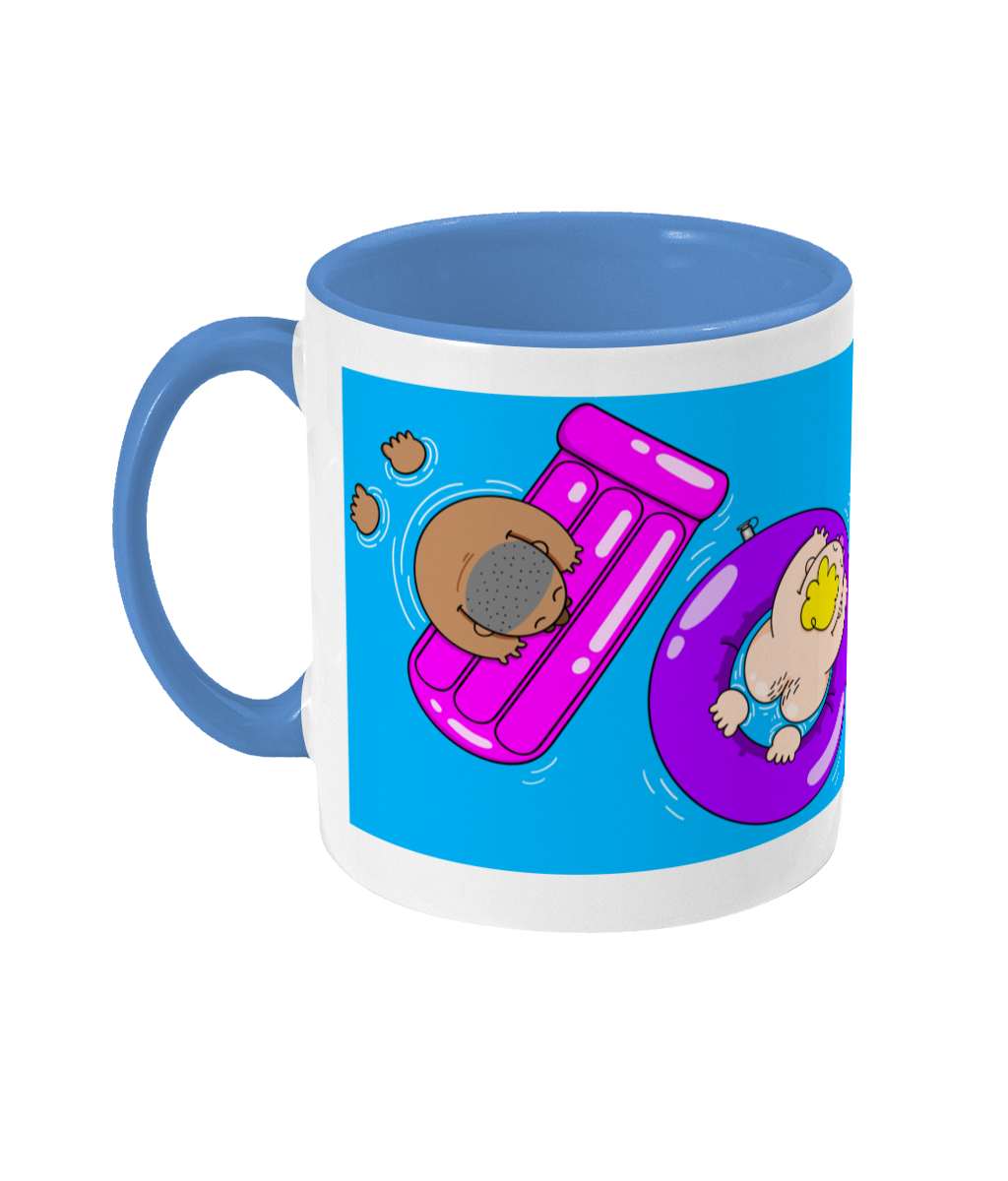 Four gay bears splashing around on colourful inflatables on a blue and white mug
