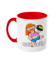 Load image into Gallery viewer, A non binary ginger person with long hair and a a moustache wearing a crop top and shorts and performing fanography with a Pride Progression flag coloured fan.
