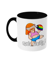Load image into Gallery viewer, A non binary ginger person with long hair and a a moustache wearing a crop top and shorts and performing fanography with a Pride Progression flag coloured fan.
